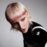 A woman with a pink bob hairstyle.
