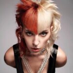 A woman with a red and orange hairstyle.
