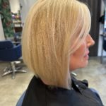 A woman with blonde hair in a salon.