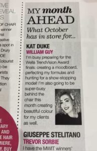 A magazine page featuring a column titled "My month AHEAD" with a photo and update from Kat Duke about her October plans, alongside brief mentions of William Guy and Giuseppe Stelitano.