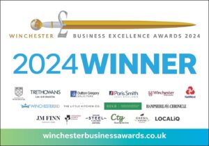 Banner for the Winchester Business Excellence Awards 2024 announcing "2024 Winner," featuring sponsor logos and the website winchesterbusinessawards.co.uk at the bottom.